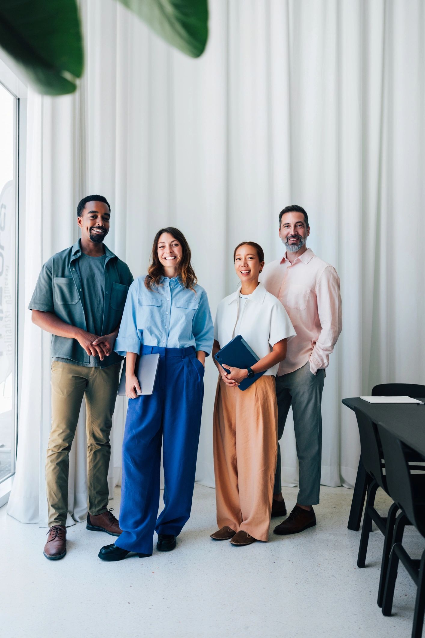 Professional business team standing together in an office